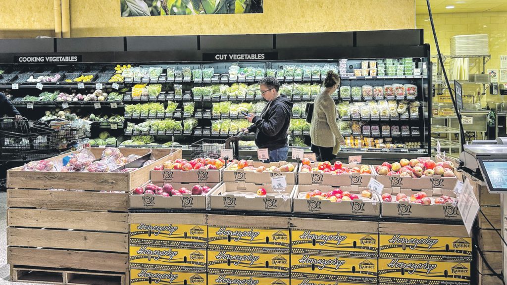 Signage is a big part of Wegmans’ merchandising. The cold case at the Lake Grove, NY, Wegmans included top signage stating, “Grown Near Our Stores Working With 125+ East Coast Farms.”