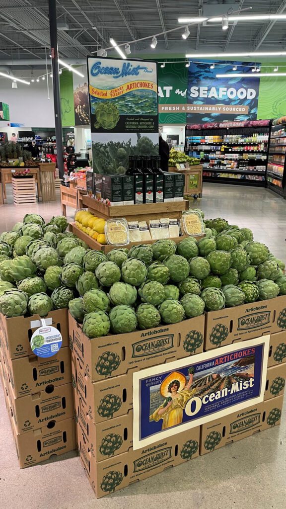 Large displays of fresh artichokes at the store level appeal to consumers.