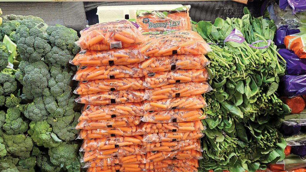 Carrots are often underused as a color break. Draw shopper attention with their bright, contrasting color and cross-merchandise with complementary produce of a different hue.