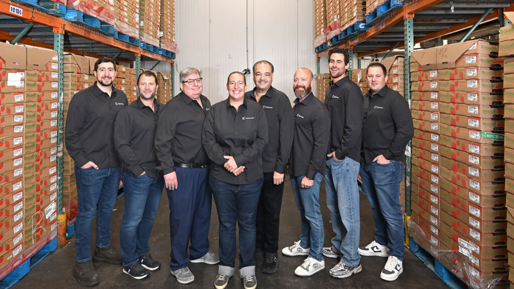 The Katzman Produce, Bronx, NY, team poses inside the Katzman Produce berry box.