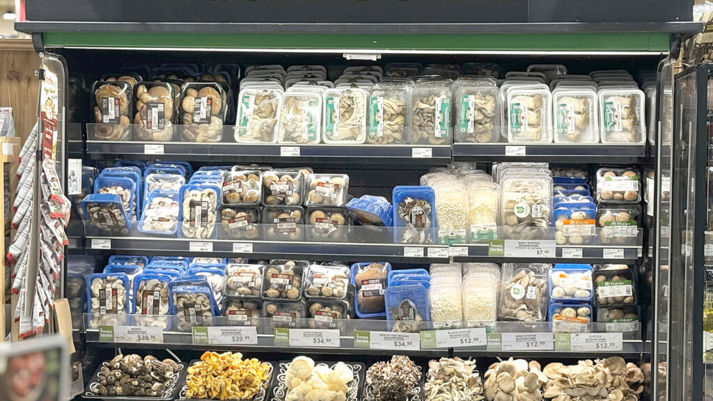 A 6-foot endcap is dedicated to a variety of mushrooms in beautifully appointed displays. Cross-merchandised next to the mushroom display is a glass case featuring truffle and other upscale oils.